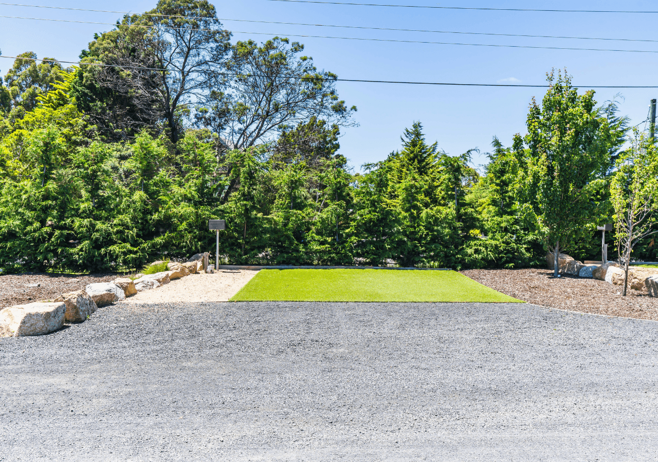 Large and flat Evergreen grass Site for camper, tent or caravan