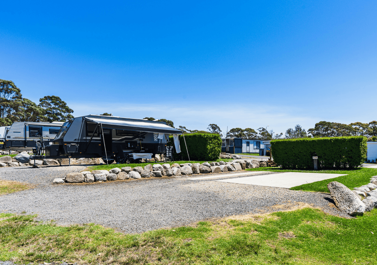 Powered site with concrete pad suitable for vans and campers