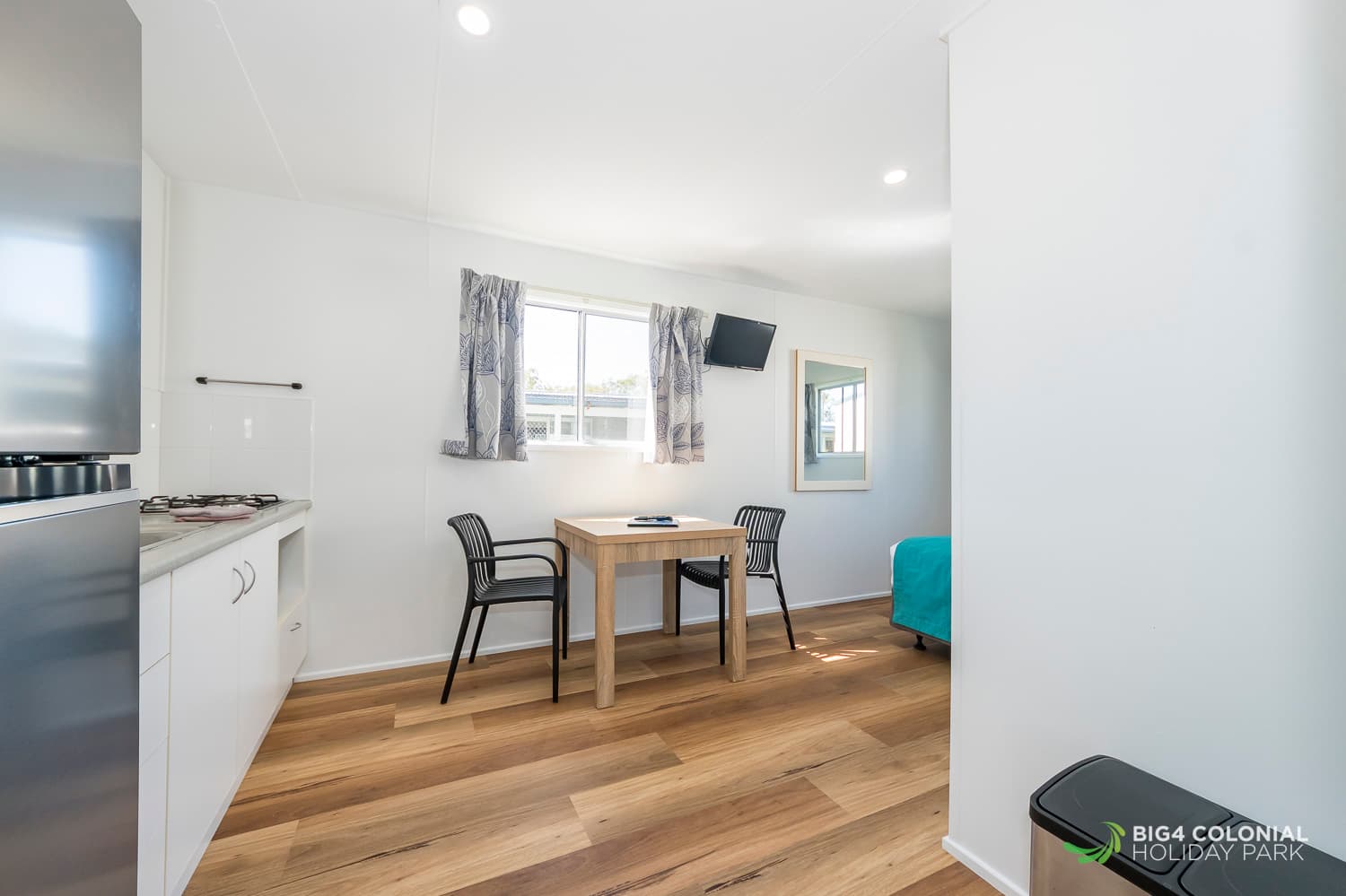 Full sized fridge and two seater 'parents escape' dining table. 