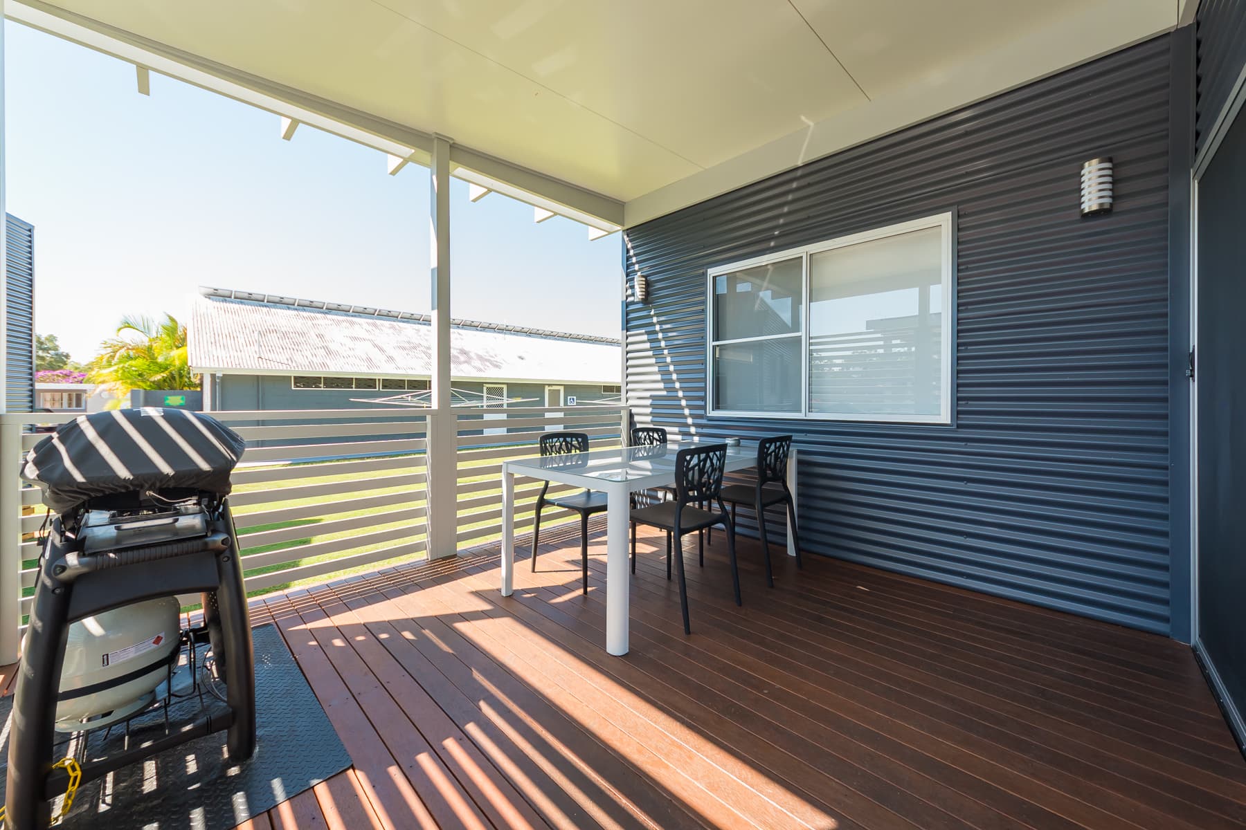 Spacious, undercover verandah with family sized Webber in our Accessible Executive Two Bedroom Villa. 