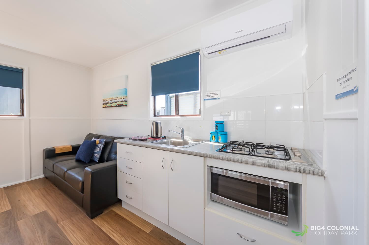 Kitchenette with microwave, gas stove, full sized fridge and kettle. 