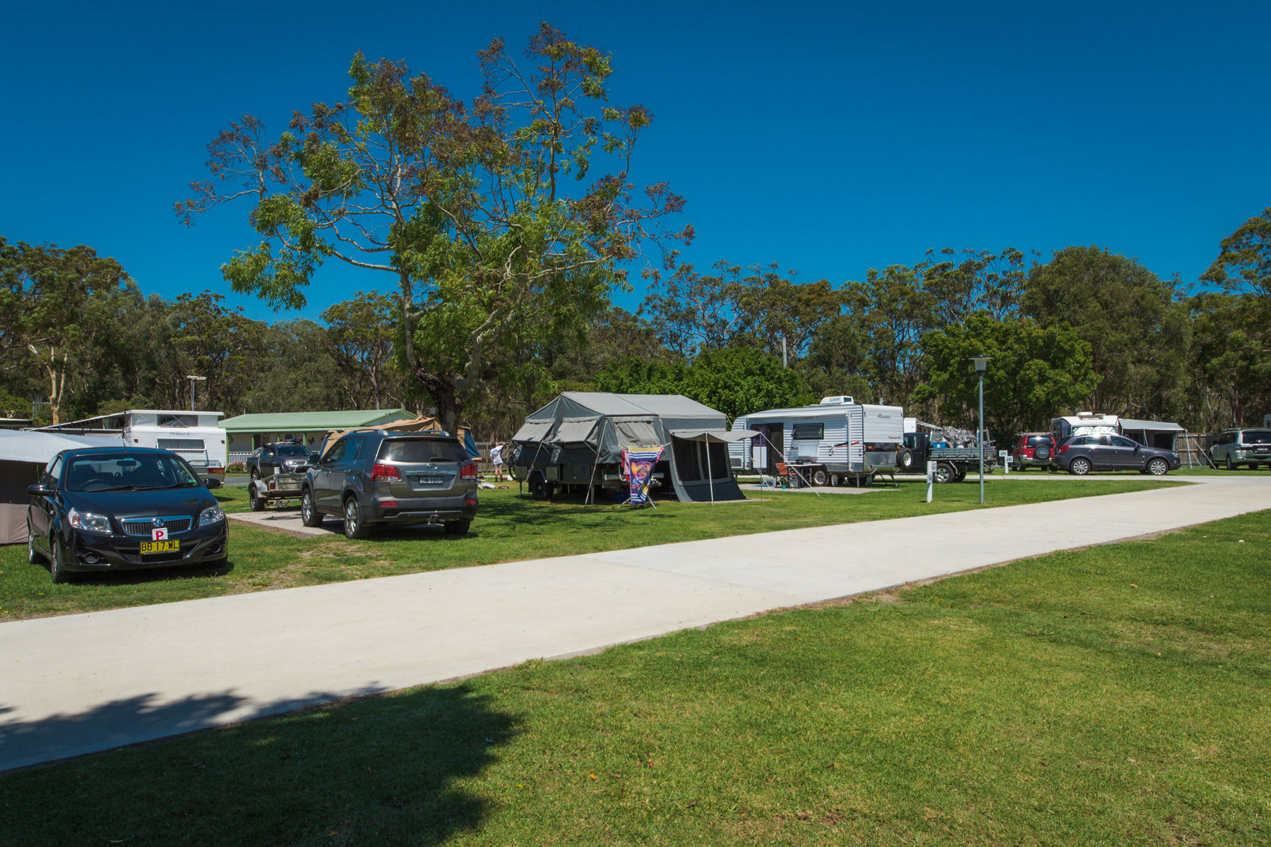 Sites with concrete slabs and grassed areas.