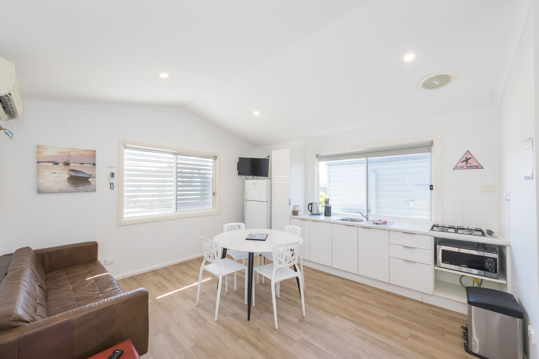 Living and kitchen area in dog friendly Two Bedroom cabin.